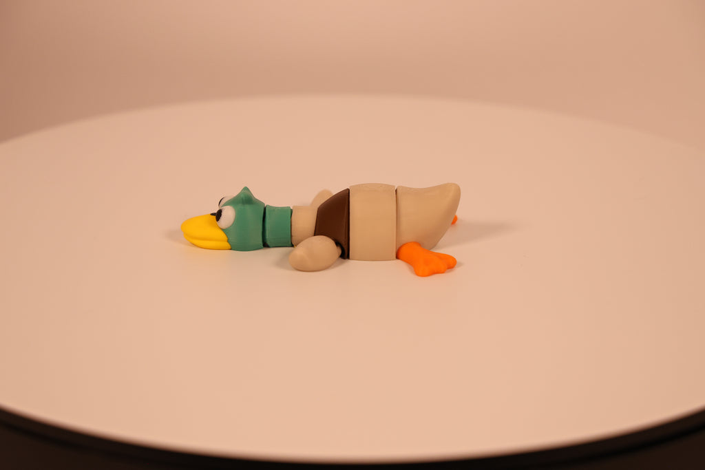 Video of Mallard colored articulated 3D‑printed Mallard Quacklet desk pet, fidget toy.