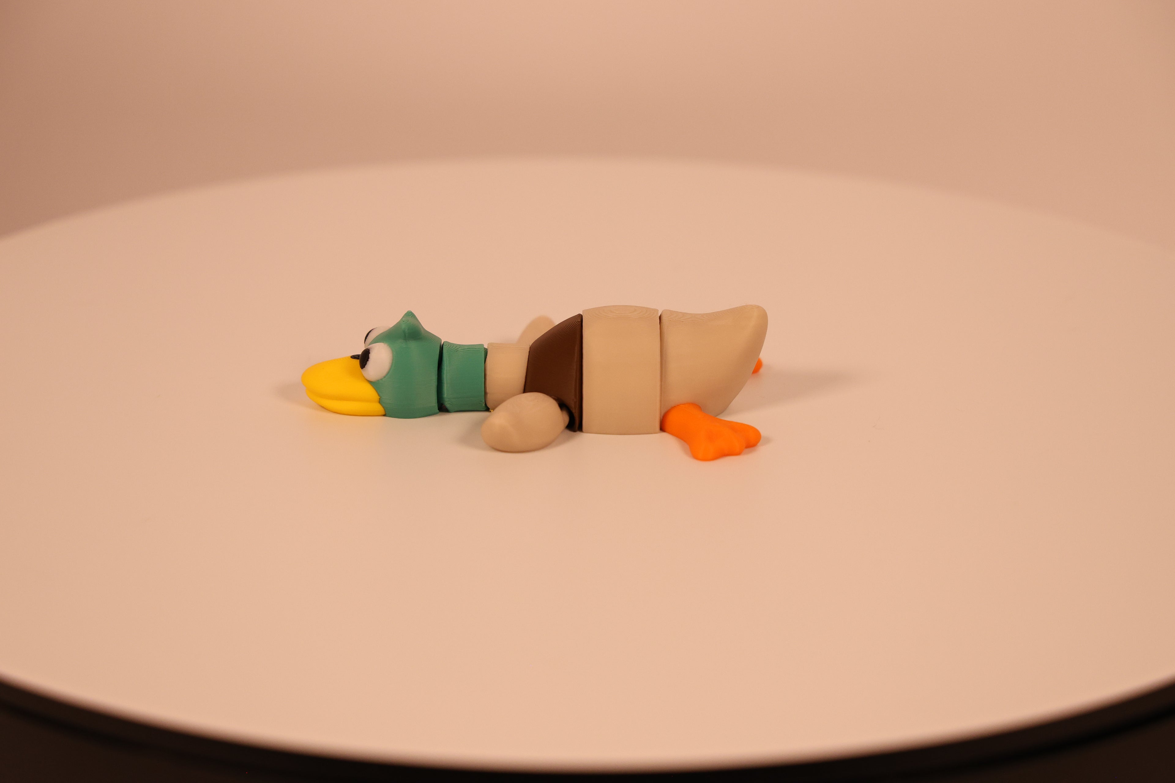 Video of Mallard colored articulated 3D‑printed Mallard Quacklet desk pet, fidget toy.