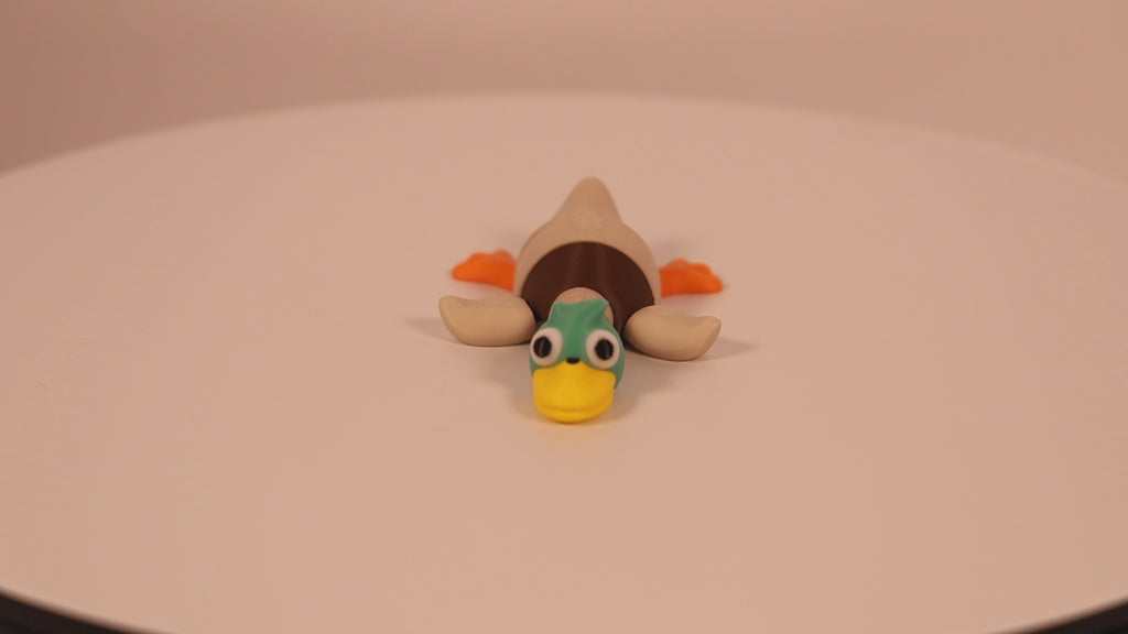 Mallard colored articulated 3D‑printed Mallard Quacklet Ver. 2.0 desk pet, fidget toy.